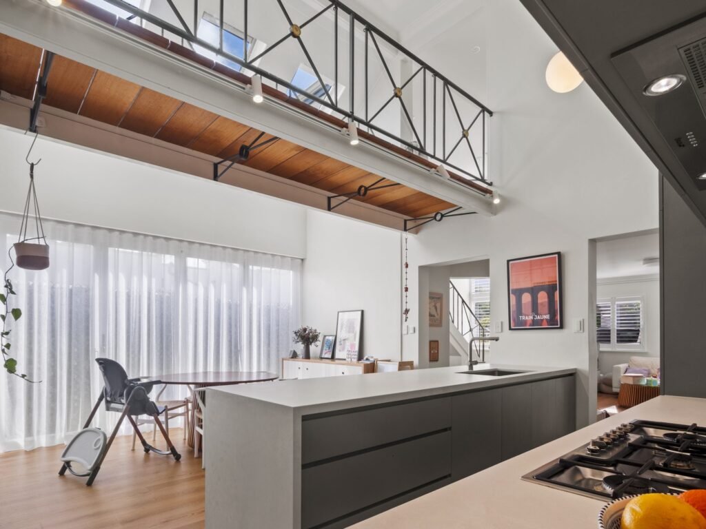 From the cooktop across the peninsula to the dining table under the mezzanine