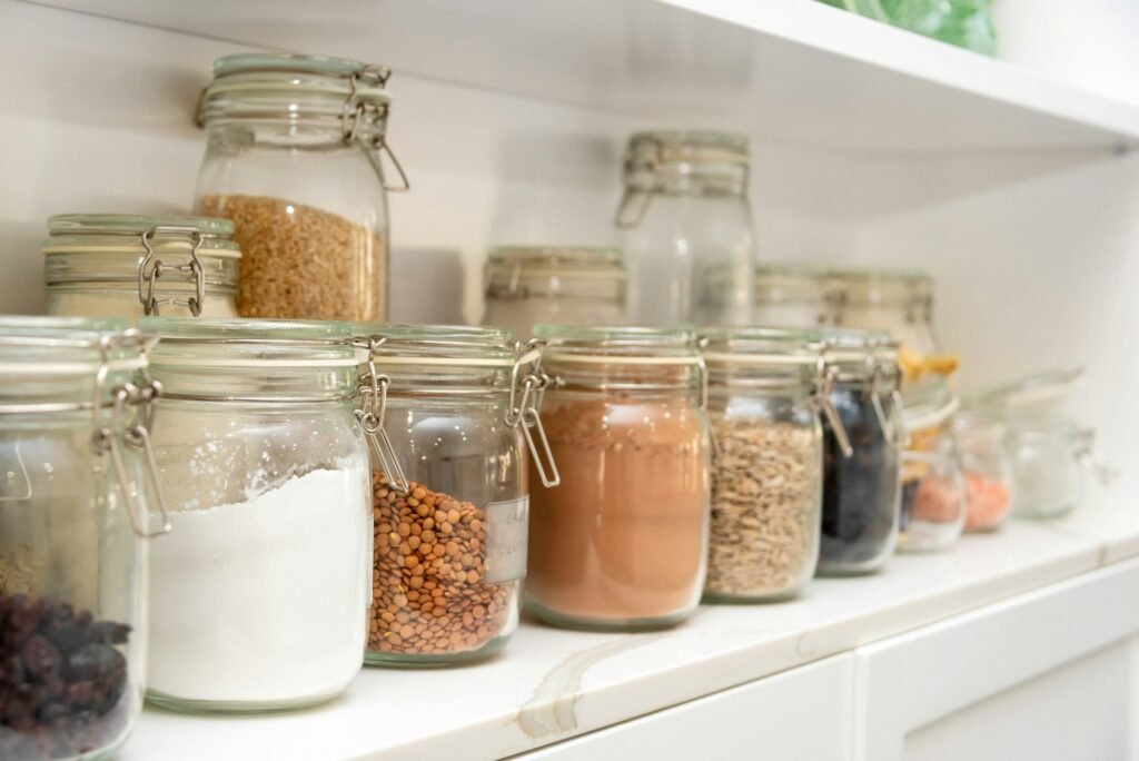 Pantry shelf with labelled glass jars of dry goods